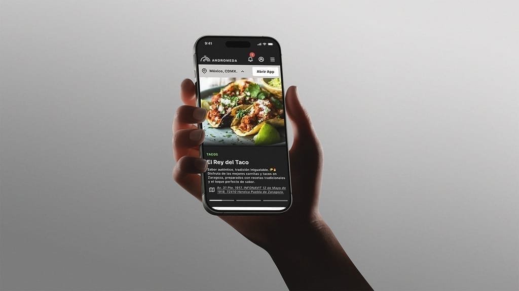 Andrómeda reservation app on smartphone mockup.