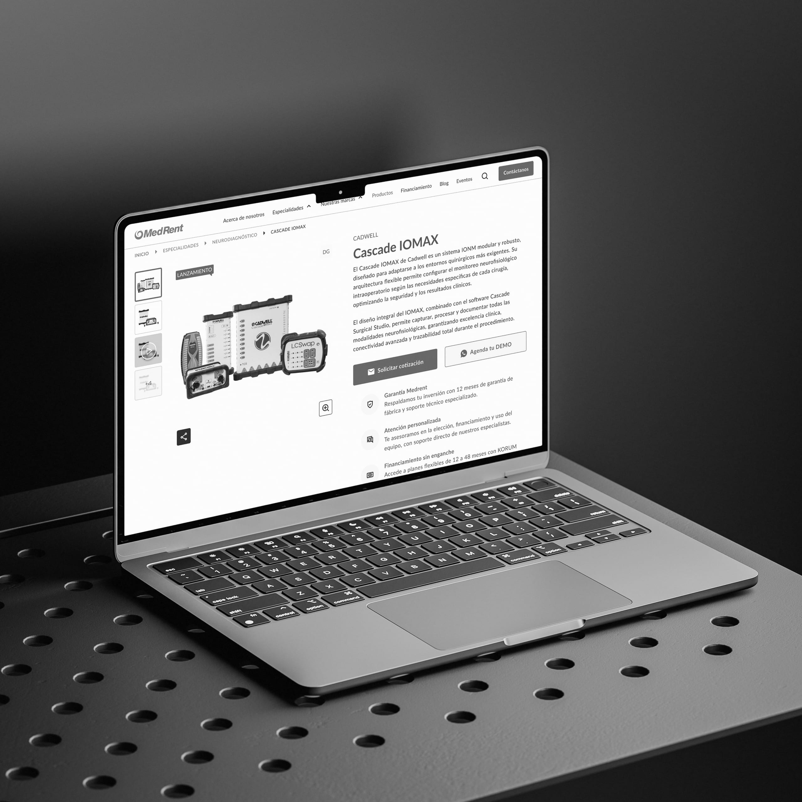 Laptop on a perforated metal table showing a medical equipment product page.