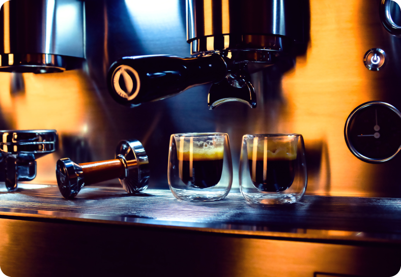 Espresso bar — professional machine and double-walled cups.